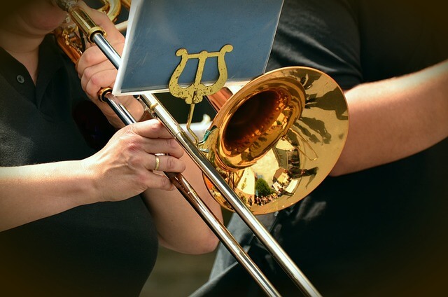 A trumpet being played by a person at an orchestra performance